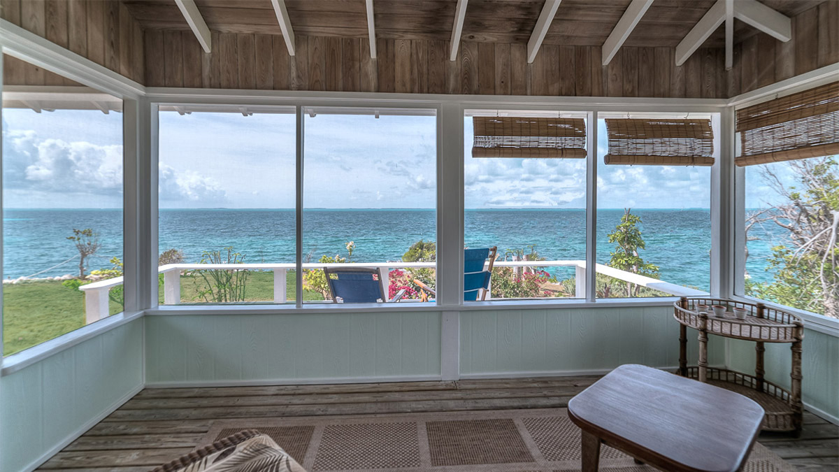 Screened in porch at Honeydew vacation rental cottage on Guana Cay